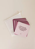 JaxKellys Shower Affirmation™ Cards - Boundaries, a purple and pink waterproof set featuring the card “I protect my time, energy, and emotions by setting healthy boundaries,” sits beside a translucent storage pouch on a light surface.