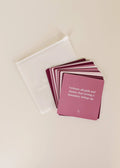 The JaxKelly Shower Affirmation™ Cards - Boundaries set features burgundy waterproof cards with white text, fanned out on a light surface beside a translucent pouch. The top card says, I release all guilt and shame that setting a boundary brings up.