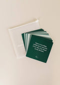JaxKellys Shower Affirmation™ Cards - Abundance: a set of dark green, waterproof, square cards featuring positive messages like I have everything within me to succeed, ideal for shower use, shown beside a semi-transparent white pouch.