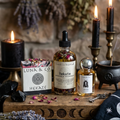 Witchcraft supplies including bottles labeled 'Luna & Co.' and 'Hekate' on a wooden surface with candles and herbs.