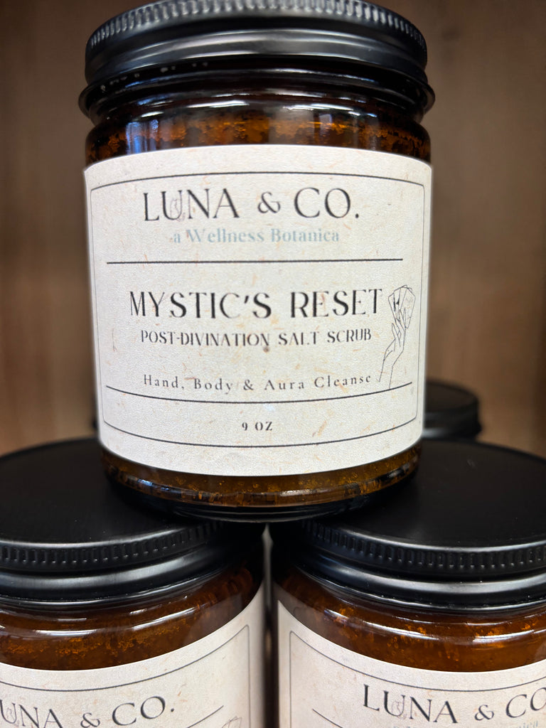 Handcrafted Mystic Reset Salt Scrub in a clear glass jar, filled with a white salt-based scrub. Infused with frankincense, myrrh, and shea butter, it’s designed for post-divination cleansing of hands and third eye, promoting grounding and spiritual clarity. 
