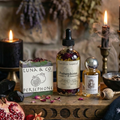 Luna & Co. products including soap, oils, and candles on a wooden surface with a mystical background.