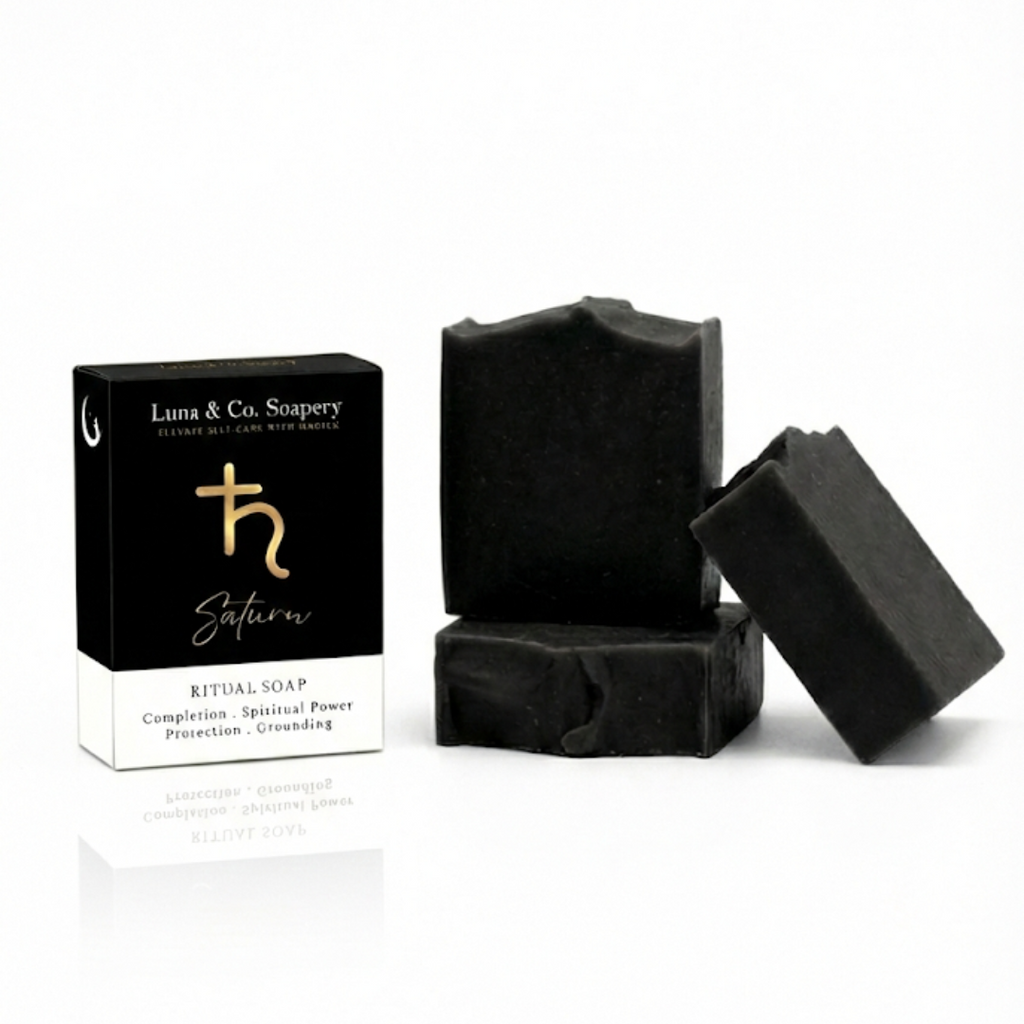 Black soap bars with packaging on a white background