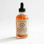 Bottle of Luna & Co. Soapery Sun Ritual Oil on a white background