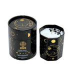 A black octagonal Earths Elements Wholesale Crystal Candle, Moon Phase (pack of 6), with gold moon and star designs, features a white candle topped with Black Obsidian crystals and comes in a matching box labeled Manifestation & Setting.