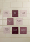 Nine JaxKelly Shower Affirmation™ Cards - Boundaries are displayed on a white tiled wall. Each waterproof card features self-care and boundary quotes in purple, pink, and beige shades, designed to inspire while you shower.