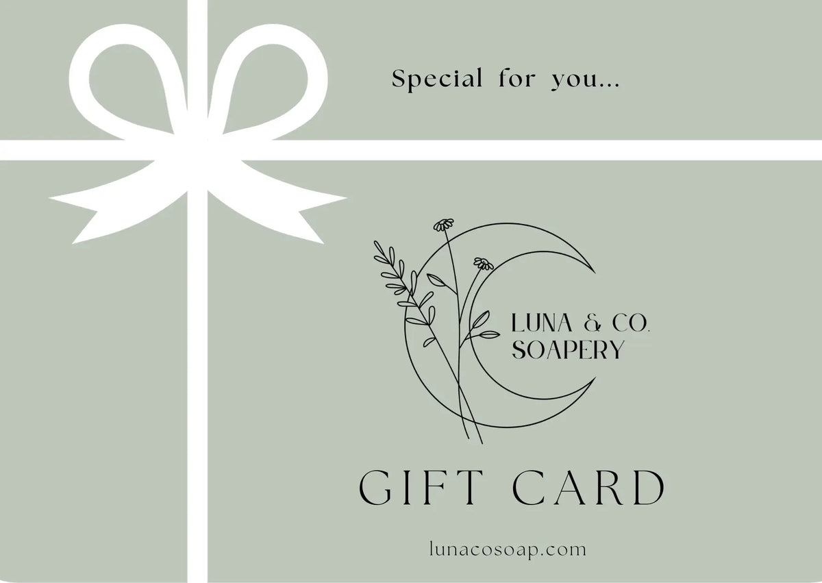 Luna & Co. Soapery Gift Card features a white ribbon and bow on a green background with the Luna & Co. Soapery logo—a perfect way to share handcrafted soaps and self-care from lunacosoap.com.
